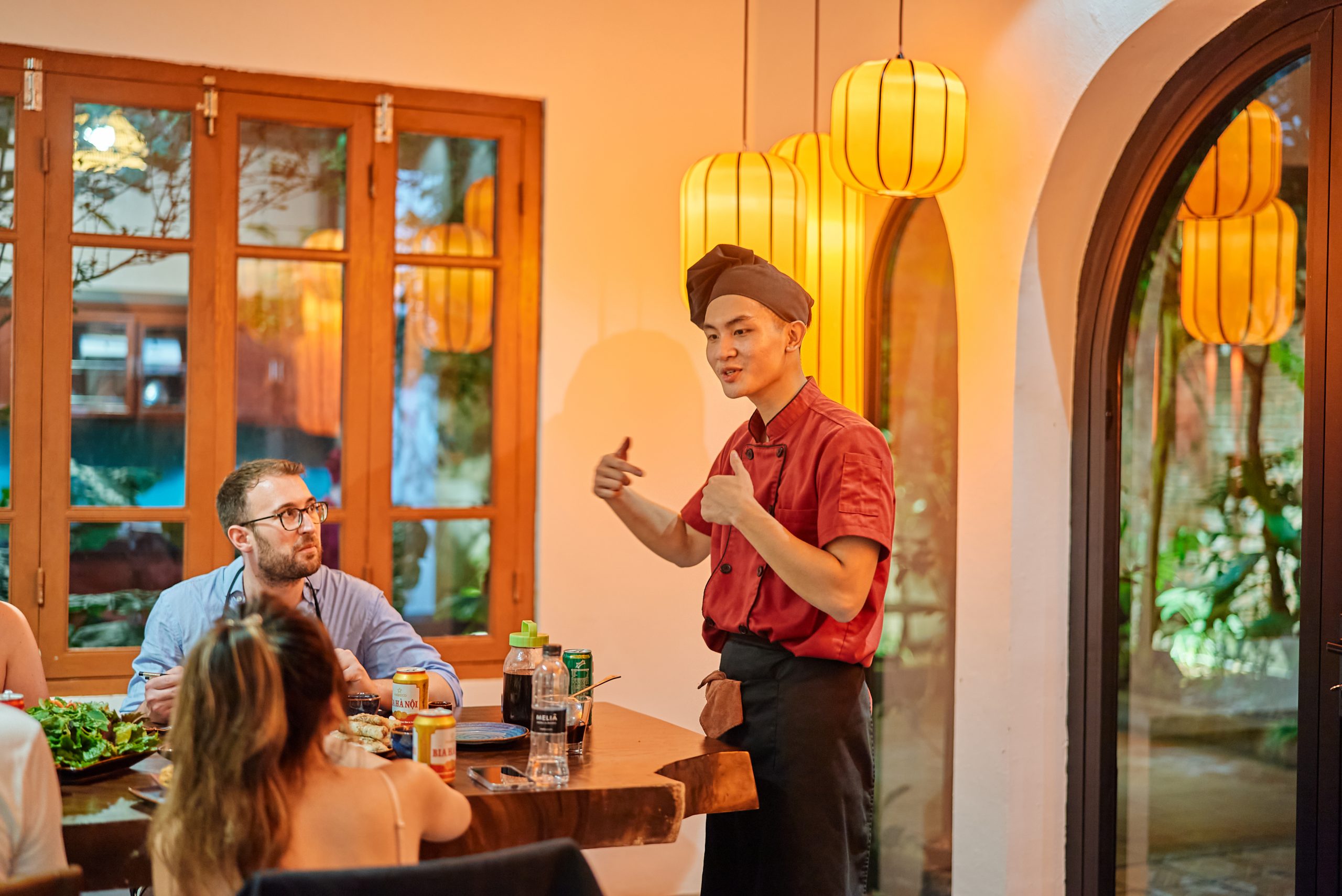 Rose Kitchen Cultural Storyteller leading the cooking class